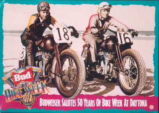 two men on motorcycles with numbers on their bikes