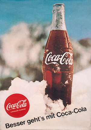 a bottle of soda on snow