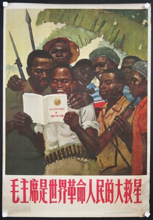 a group of men reading a book