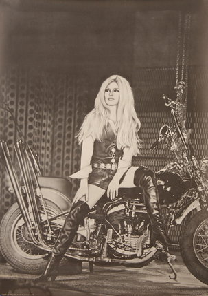 a woman sitting on a motorcycle