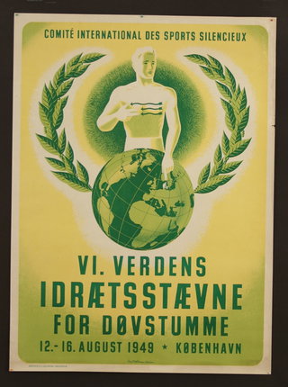 a poster with a man holding a globe