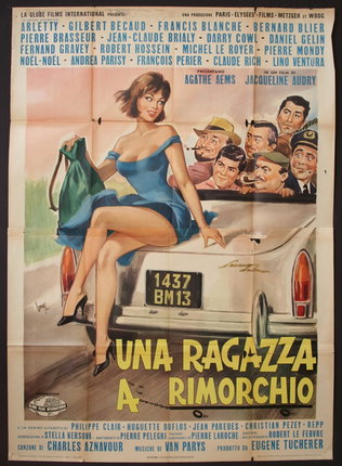 a poster of a woman sitting on a car