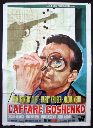 a movie poster of a man holding a magnifying glass