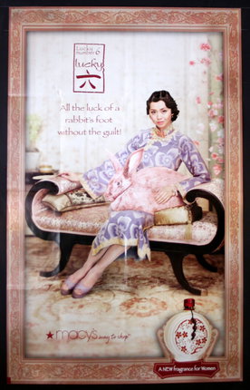 a poster of a woman sitting on a couch