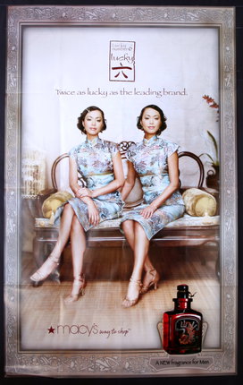a poster of two women sitting on a couch