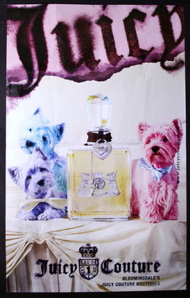 a poster of dogs and a bottle of perfume