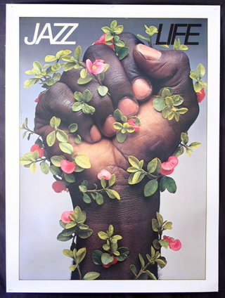 a cover of a magazine with a hand covered with leaves