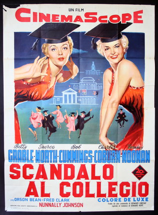 a movie poster of two women wearing graduation caps