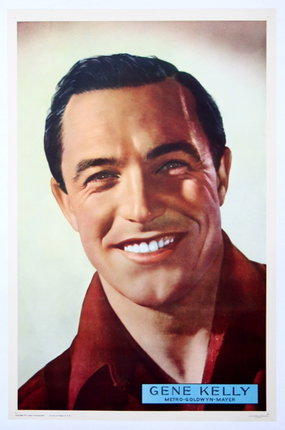 a man smiling with a red shirt
