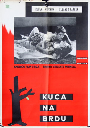 a movie poster with a man and woman lying on a blanket
