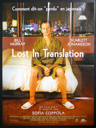 a movie poster of a man sitting on a bed