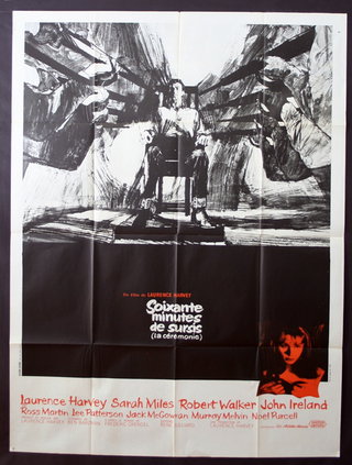a movie poster of a man sitting in a chair