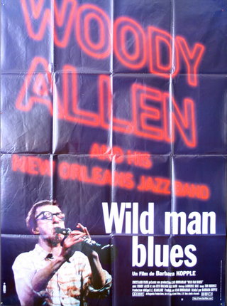 a poster with a man playing a guitar