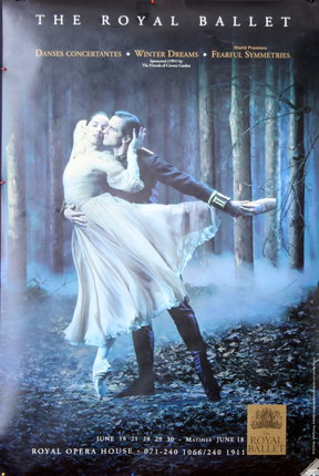 a man and woman dancing in the woods