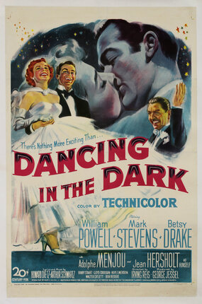 a movie poster with a man kissing a woman and a couple in evening wear