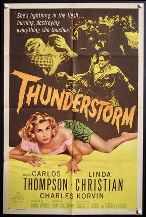 a movie poster with a woman lying on the ground