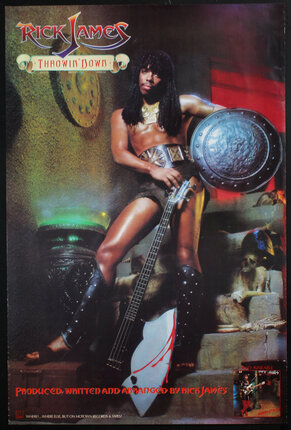 Rick James holding a guitar and a shield