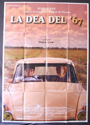 a movie poster of a man and woman in a car