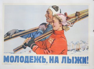 a man and woman carrying skis