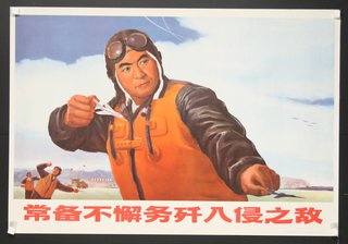 a poster of a man holding a pair of paper airplanes
