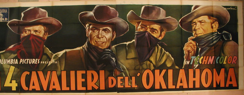 a poster of two men wearing cowboy hats and bandanas