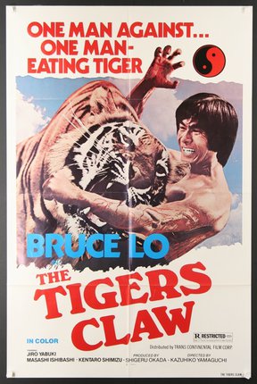 a movie poster of a man holding a tiger