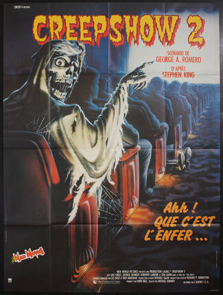 a movie poster of a creep pointing to a movie screen