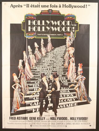 a movie poster of a man and woman on a staircase