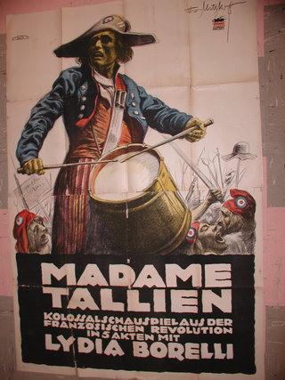 a poster of a man holding a drum