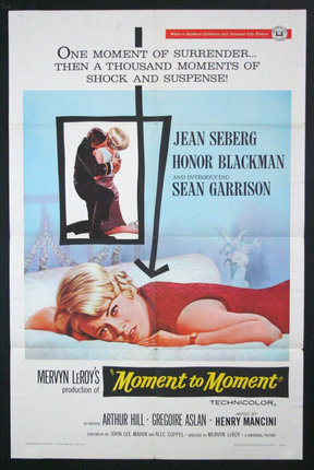 a movie poster with a woman lying on a bed
