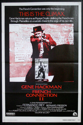a movie poster of a man holding a gun with Grand Guignol in the background