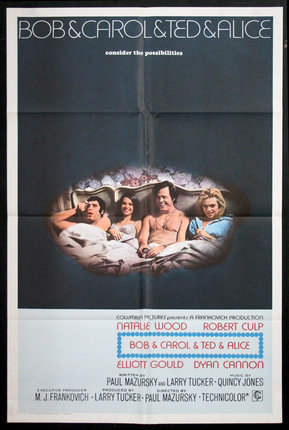 a movie poster of a group of people lying on a bed