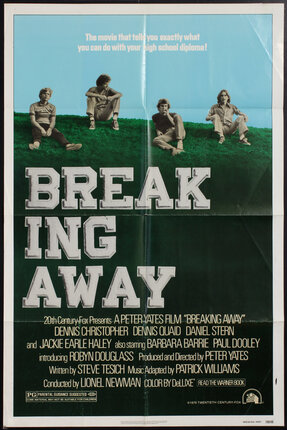 a movie poster with a group of men sitting on grass