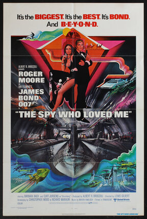 a movie poster with sexy spies holding guns above an evil underground submarine lair and underwater scenes