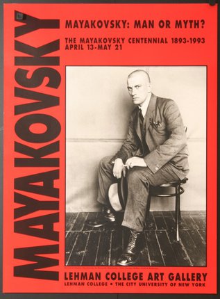 a poster of a man sitting on a chair