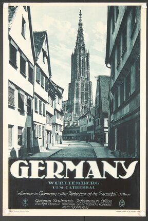 a black and white photo of a street with buildings and a tall tower