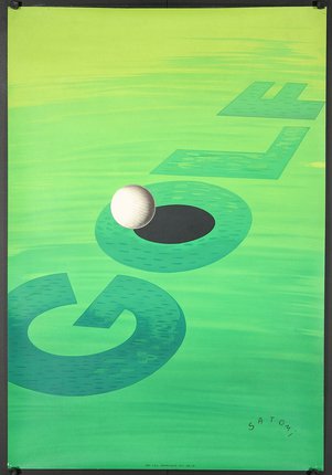 a golf ball on a green surface