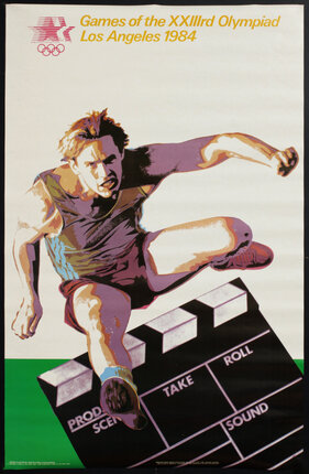 a man jumping over a clapper board