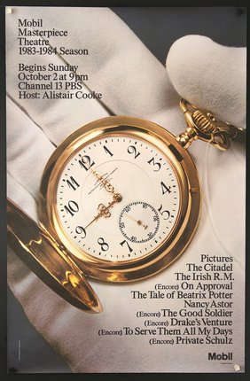 a gold pocket watch on a white cloth