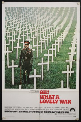 a poster of a soldier standing in a field of white crosses