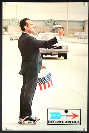 a man in a suit holding a bucket and giving a thumbs up