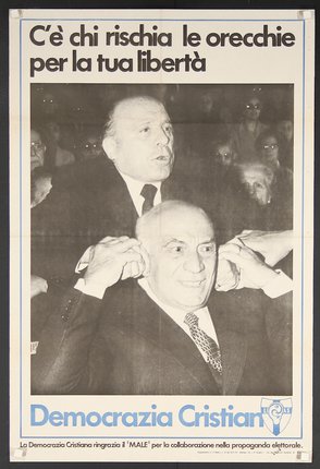 a man putting his ears in a man's ear