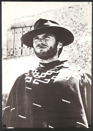 a man wearing a hat and poncho