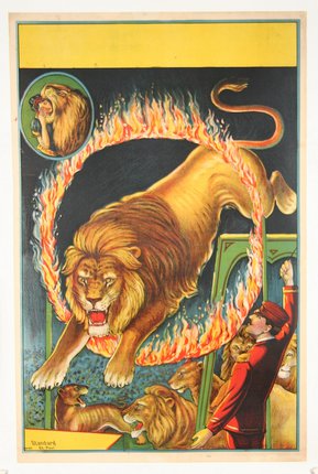 a lion jumping through a ring of fire