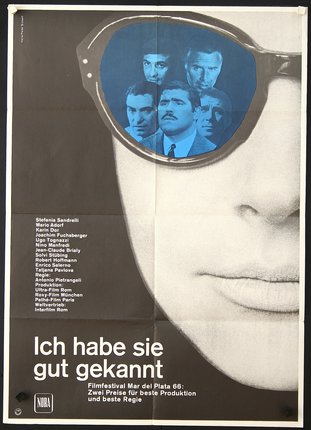 a movie poster of a man wearing sunglasses