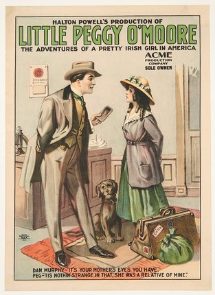 a man and woman standing next to a dog