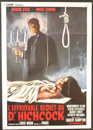 a poster of a man holding a candle and a woman lying on a bed