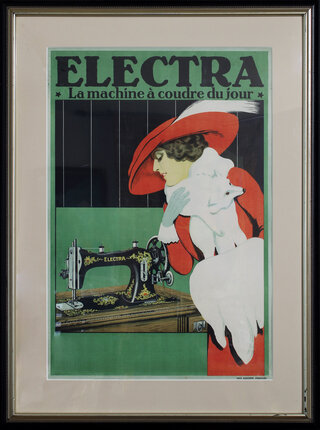 a framed picture of a woman holding a sewing machine