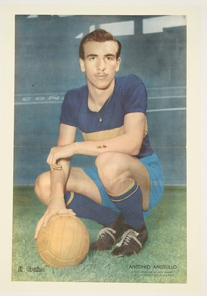 a man in a football uniform holding a ball