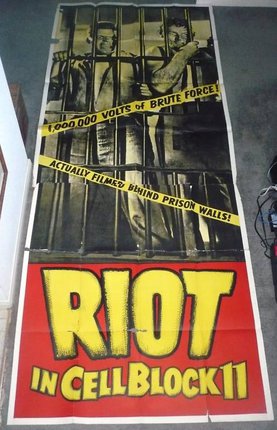a poster with a yellow tape on it